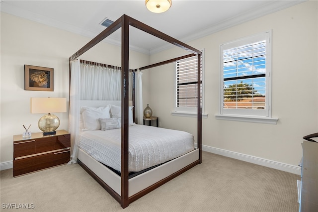 bedroom with light carpet, visible vents, crown molding, and baseboards