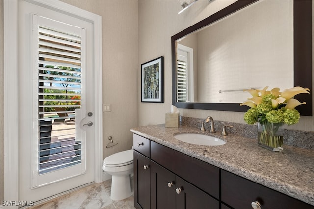 bathroom with vanity and toilet