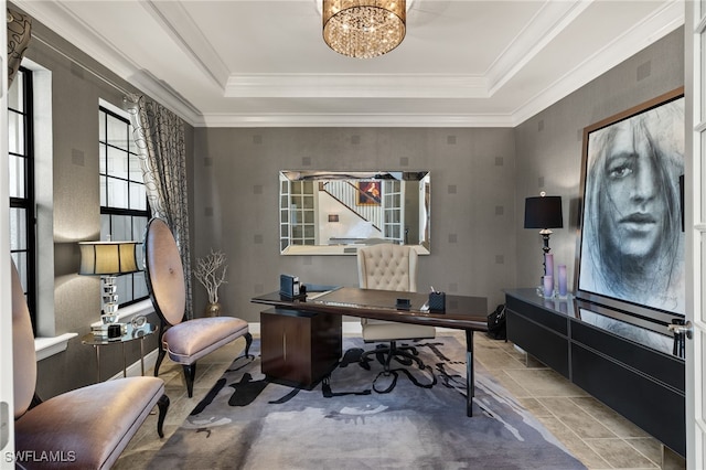 office area featuring a tray ceiling, a chandelier, crown molding, and stone finish flooring