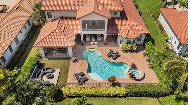 view of swimming pool with an in ground hot tub, a patio area, a fenced in pool, and a fenced backyard