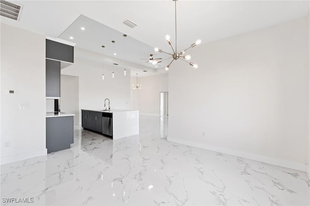 kitchen with hanging light fixtures, light countertops, a notable chandelier, and visible vents