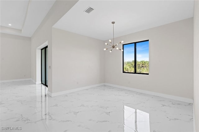 unfurnished room with a notable chandelier, marble finish floor, recessed lighting, and baseboards