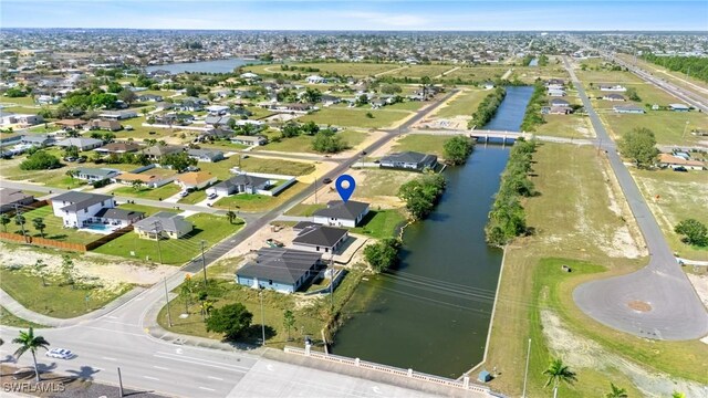 birds eye view of property featuring a residential view and a water view