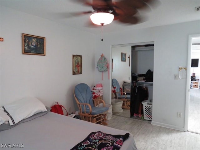 bedroom featuring a closet, ceiling fan, and wood finished floors