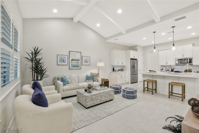 living room with high vaulted ceiling and beam ceiling