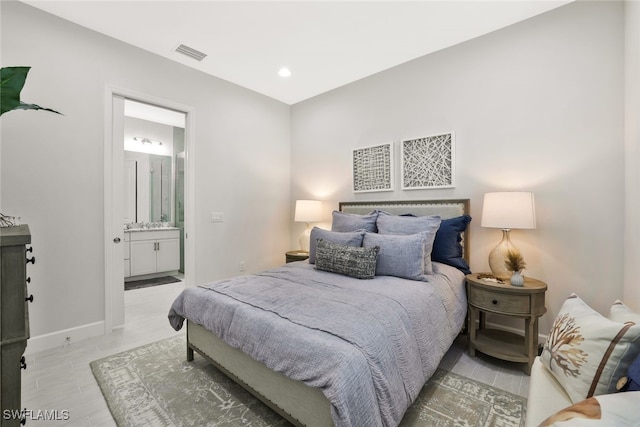 bedroom featuring ensuite bathroom