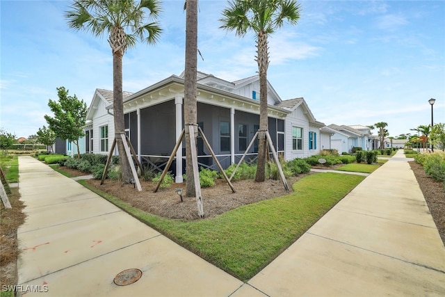 view of home's exterior featuring a sunroom