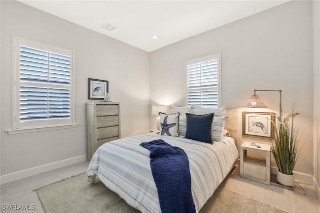 bedroom featuring multiple windows