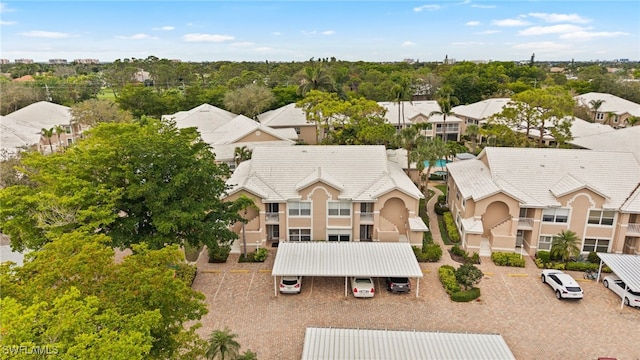 birds eye view of property with a residential view