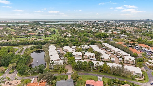 birds eye view of property featuring a residential view and a water view