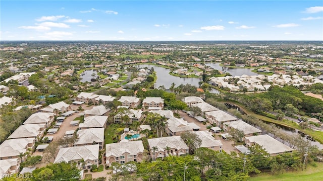 birds eye view of property with a water view and a residential view