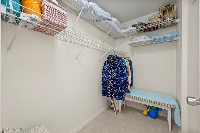 spacious closet featuring tile patterned flooring