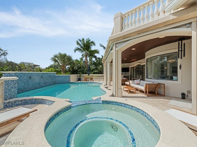 view of pool featuring a patio and a pool with connected hot tub