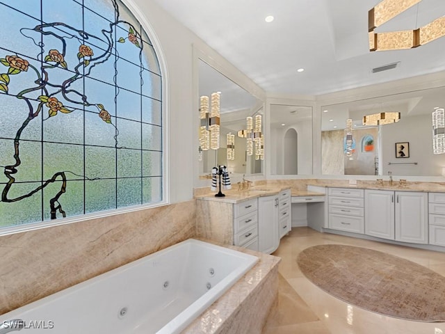 bathroom featuring a tub with jets, recessed lighting, vanity, and visible vents