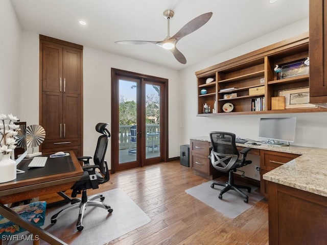 office featuring light wood-type flooring, a ceiling fan, recessed lighting, french doors, and baseboards