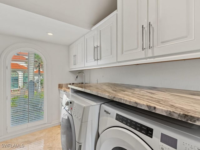 laundry area with recessed lighting, cabinet space, and washer and clothes dryer