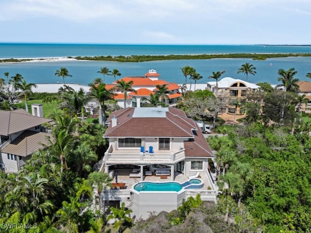 drone / aerial view with a water view