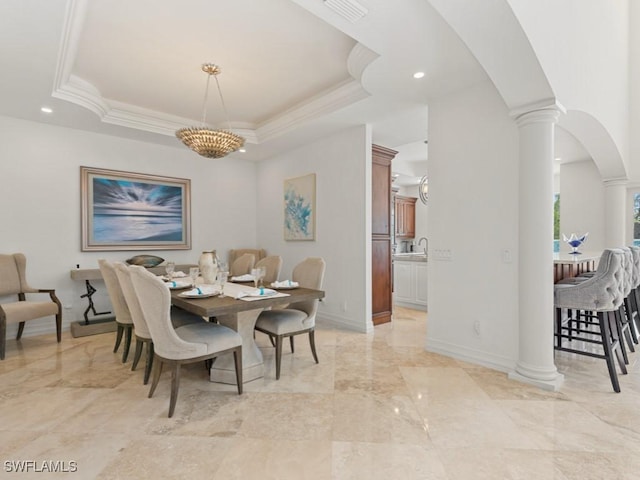 dining area featuring arched walkways, visible vents, a tray ceiling, and decorative columns