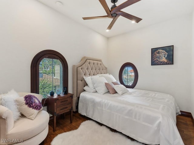 bedroom with a ceiling fan and wood finished floors