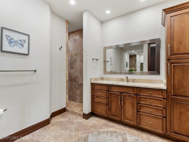 full bath featuring recessed lighting, baseboards, walk in shower, and vanity