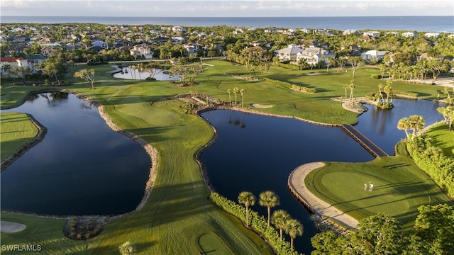 bird's eye view with a water view and golf course view