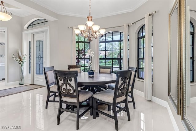 dining room featuring an inviting chandelier, crown molding, and french doors