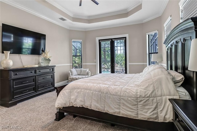 bedroom with access to outside, ceiling fan, crown molding, a raised ceiling, and carpet