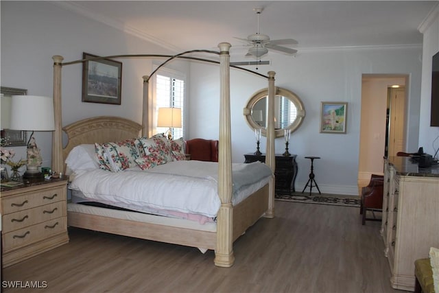 bedroom featuring ceiling fan, ornamental molding, dark wood-type flooring, and baseboards