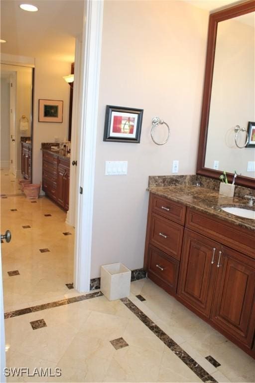 bathroom with recessed lighting and vanity