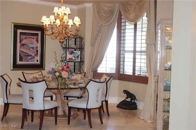 dining area with an inviting chandelier, baseboards, and ornamental molding