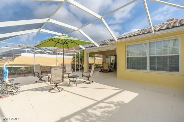 view of patio / terrace with a lanai