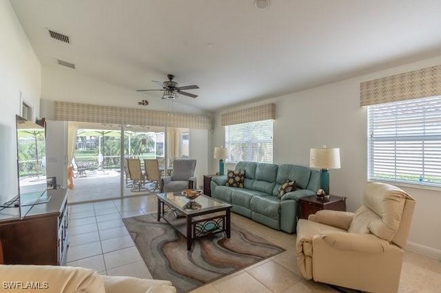 living area featuring light tile patterned floors, visible vents, and a ceiling fan