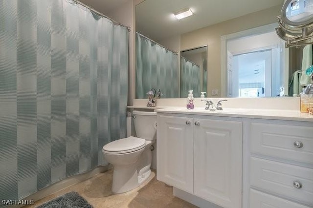 full bath with toilet and vanity