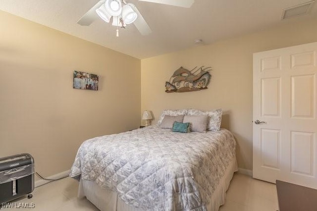 bedroom with baseboards and a ceiling fan