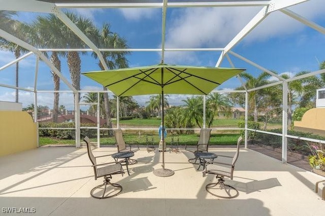 view of patio featuring a lanai