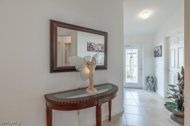 foyer featuring light tile patterned floors