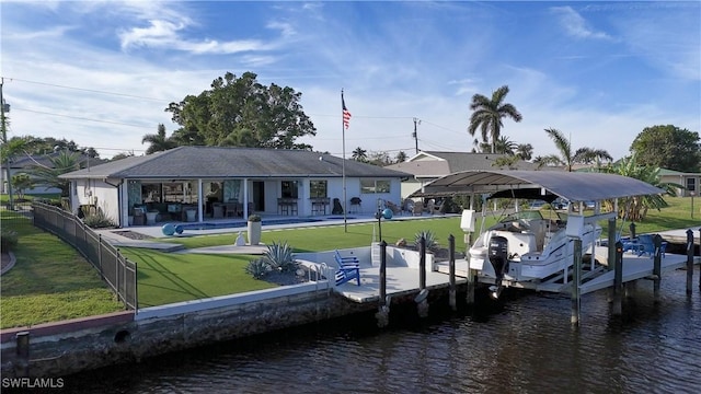 view of dock with boat lift, a water view, a lawn, fence, and a swimming pool