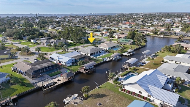 aerial view featuring a water view and a residential view