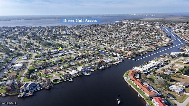 aerial view with a residential view and a water view