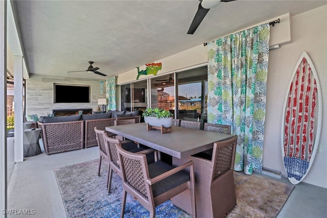 view of patio / terrace with outdoor dining area, outdoor lounge area, and a ceiling fan