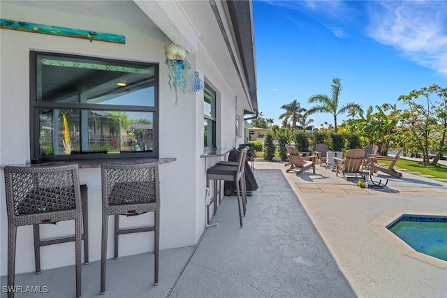 view of patio featuring an outdoor pool