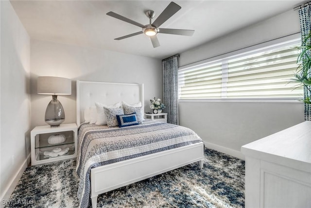 bedroom featuring ceiling fan and baseboards