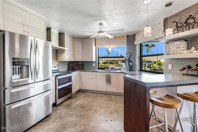 kitchen with open shelves, stainless steel appliances, wall chimney range hood, a peninsula, and a kitchen breakfast bar