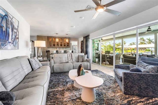 living area with a ceiling fan