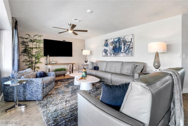 living room with a ceiling fan and visible vents