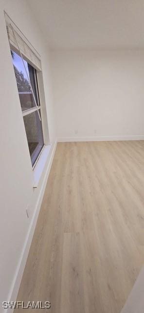 spare room featuring light hardwood / wood-style flooring