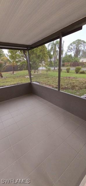 unfurnished sunroom with a mountain view