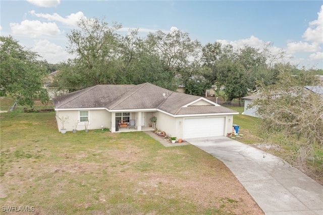 ranch-style house featuring a garage, covered porch, and a front lawn