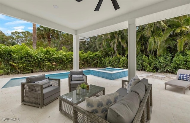 outdoor pool featuring a ceiling fan, an in ground hot tub, a patio area, and an outdoor hangout area