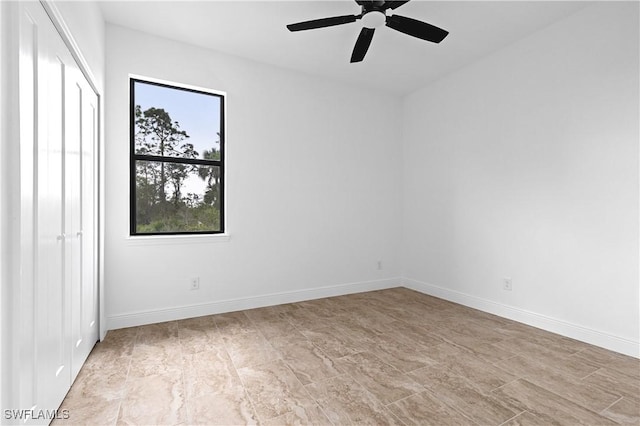 spare room with ceiling fan